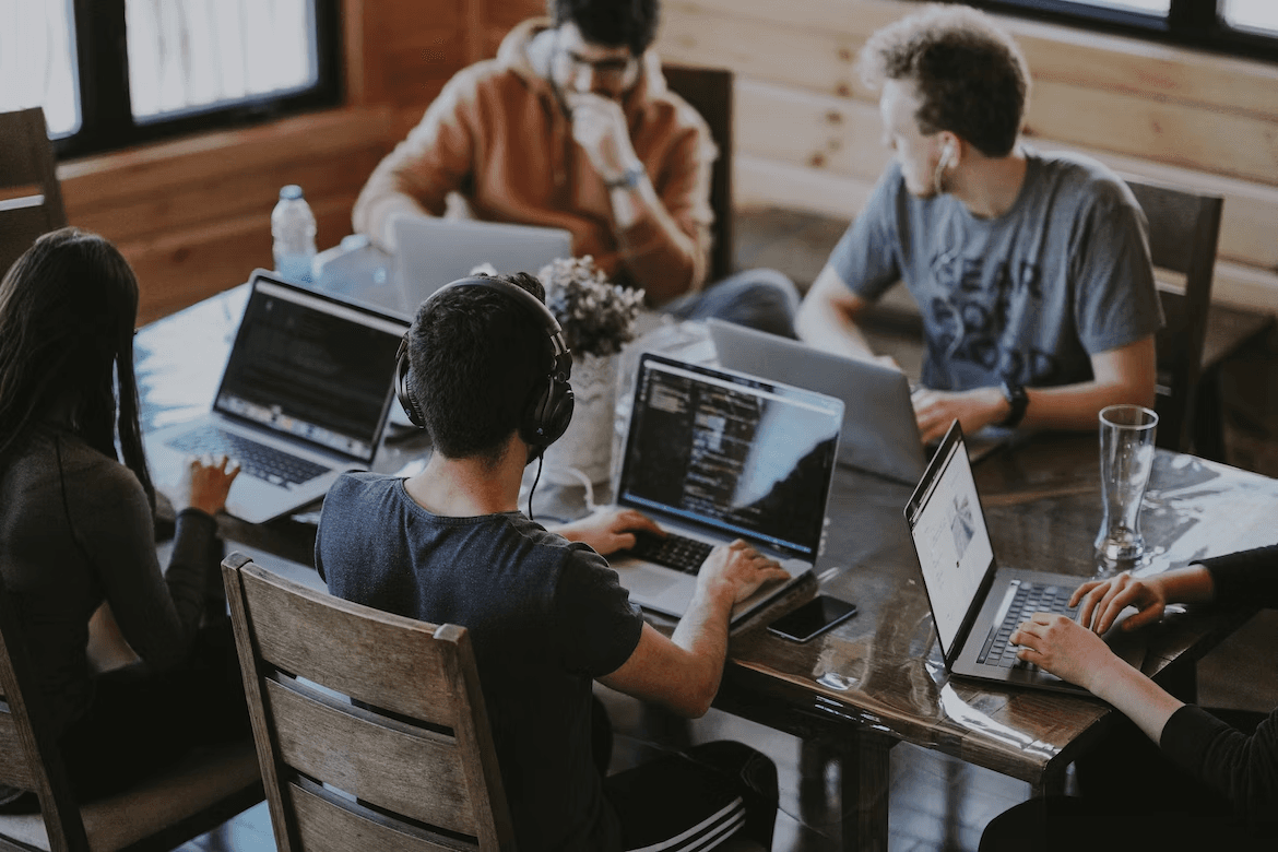 a team of people working on their computers